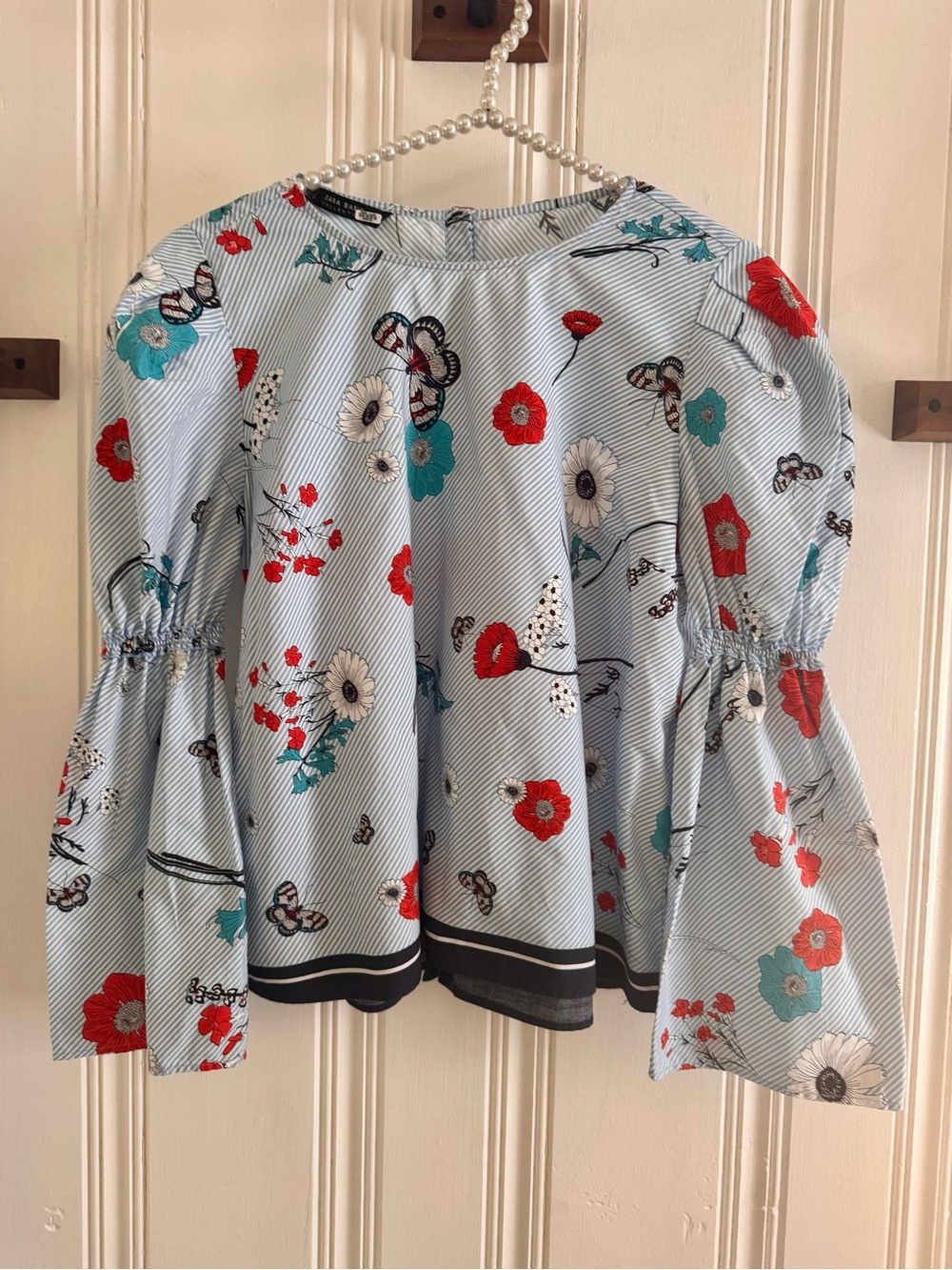 Zara Light Blue Floral Bell-Sleeve Blouse with Red & Teal Accents